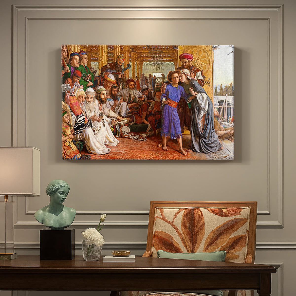 Canvas art print featuring a crowded temple scene with figures in robes surrounding central figure, presented within a refined interior setting