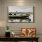 Canvas art print featuring two boys seated in small boat floating on calm water, presented within a refined interior setting