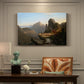 Canvas art print featuring a rugged mountain landscape with small figures near water and rocky cliffs, presented within a refined interior setting