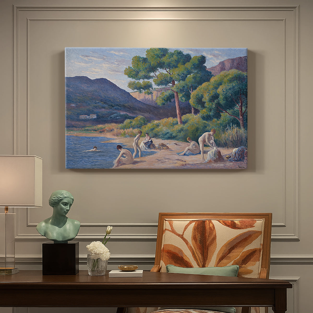 Canvas art print featuring figures bathing along shoreline in bright coastal landscape, presented within a refined interior setting