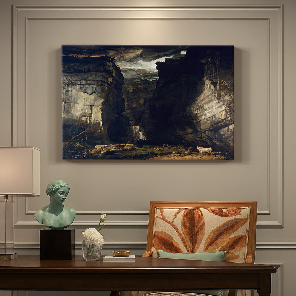 Canvas art print featuring a dramatic rocky gorge with towering cliffs and waterfall, presented within a refined interior setting