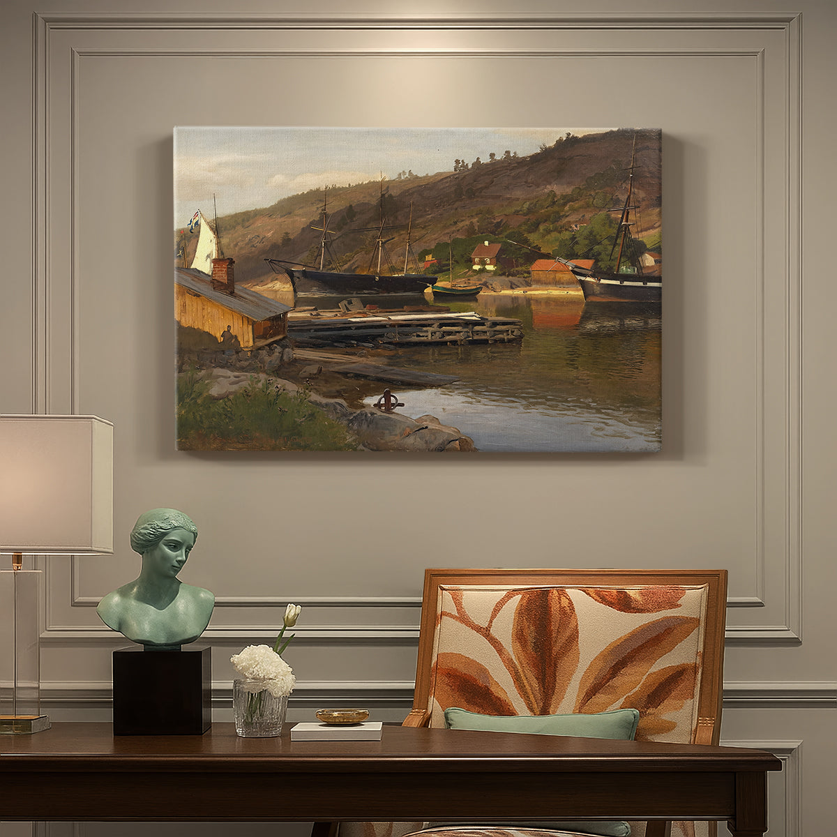 Canvas art print featuring a small harbor with boats docked along shoreline near buildings, presented within a refined interior setting