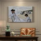 Canvas art print featuring figures seated on beach with parasols facing the ocean, presented within a refined interior setting