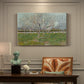 Canvas art print featuring evenly spaced trees covered in blossoms across flat orchard landscape, presented within a refined interior setting