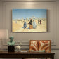 Canvas art print featuring figures traveling across desert with distant city and tombs on horizon, presented within a refined interior setting
