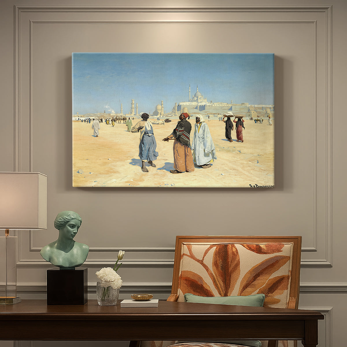 Canvas art print featuring figures traveling across desert with distant city and tombs on horizon, presented within a refined interior setting