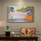 Canvas art print featuring a coastal landscape with trees and water, presented within a refined interior setting