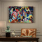 Canvas art print featuring a chaotic abstract composition with dense overlapping colors and forms suggesting turbulent motion, presented within a refined interior setting