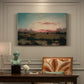 Canvas art print featuring an expansive marshland with water channels and horizon, presented within a refined interior setting