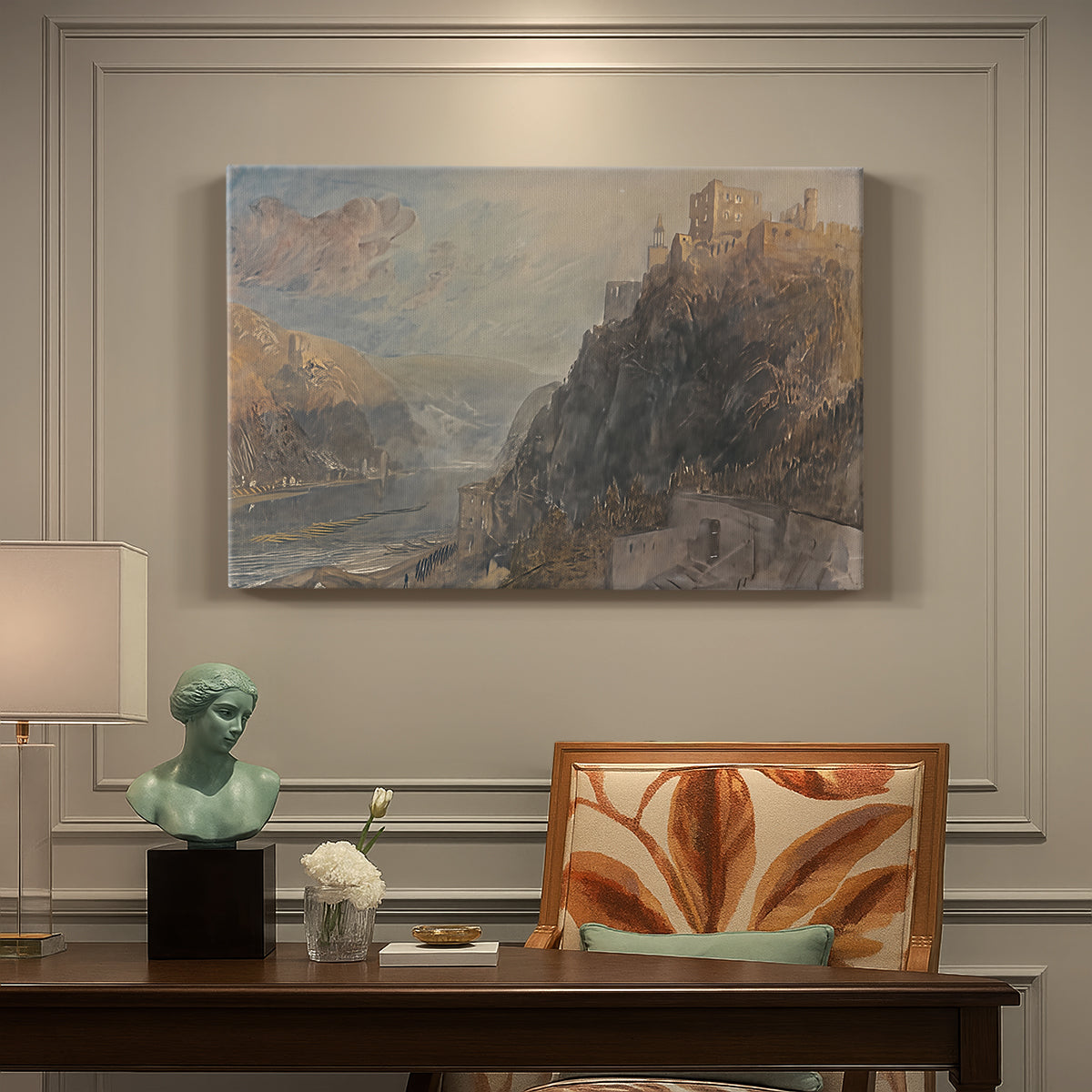 Canvas art print featuring a river landscape with castles along steep terrain, presented within a refined interior setting