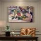 Canvas art print featuring a tabletop still life with pineapple, lemons, and fruit, presented within a refined interior setting