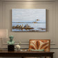 Canvas art print featuring a group of geese gathered near water in a natural wetland landscape, presented within a refined interior setting