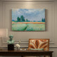 Canvas art print featuring a golden wheat field stretching across landscape under soft sky, presented within a refined interior setting