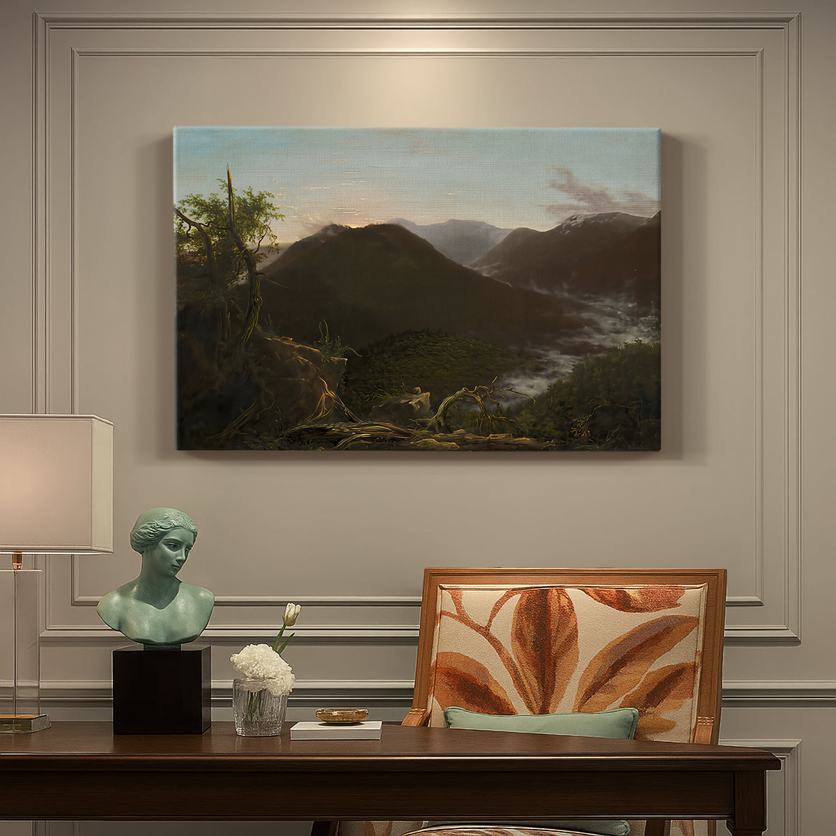 Canvas art print featuring a mountain valley at sunrise with light spreading across trees and hills, presented within a refined interior setting