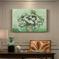 Canvas art print featuring a cluster of roses arranged in soft still life with light background, presented within a refined interior setting