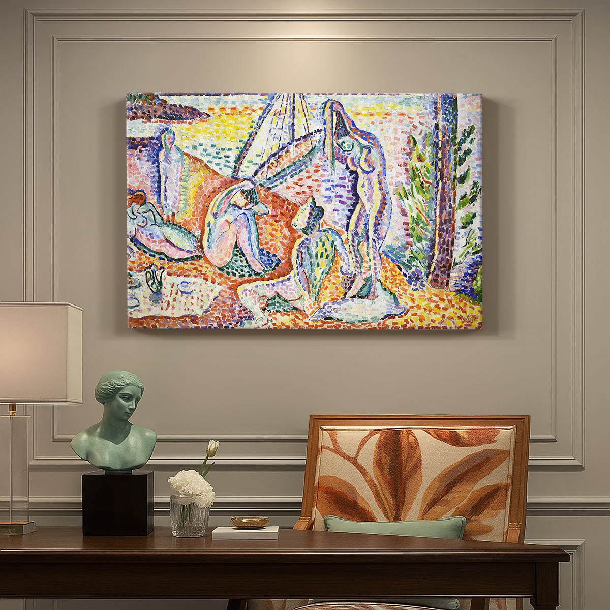Canvas art print featuring figures relaxing in a bright coastal landscape with water and trees, presented within a refined interior setting