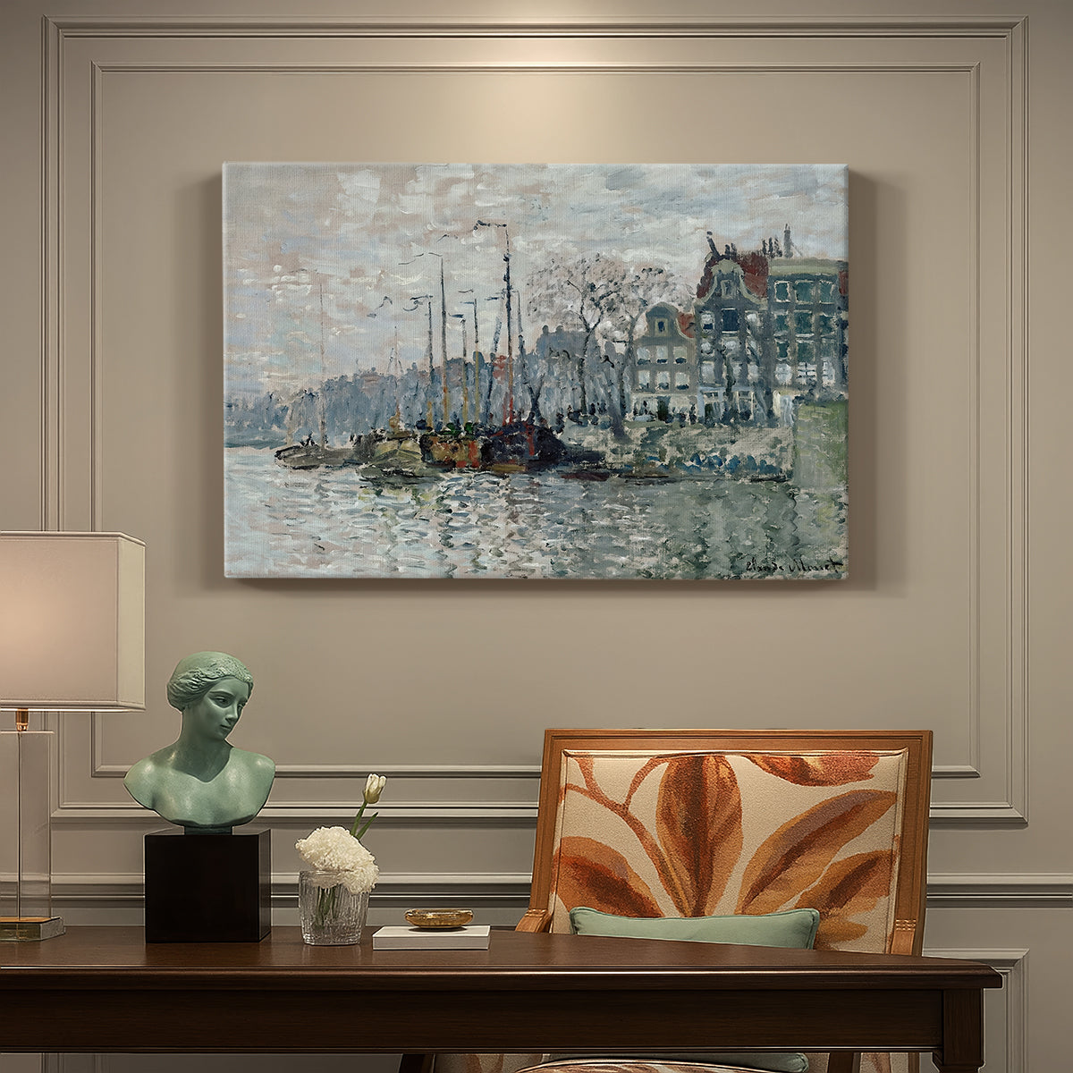 Canvas art print featuring a canal scene with boats and buildings lining waterfront in Amsterdam, presented within a refined interior setting