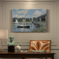 Canvas art print featuring a bridge spanning river with sailboats and reflections in bright daylight, presented within a refined interior setting