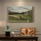 Canvas art print featuring an industrial factory building with figures working in outdoor setting, presented within a refined interior setting