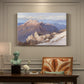 Canvas art print featuring a distant mountain peak viewed from elevated ridge with sweeping landscape, presented within a refined interior setting
