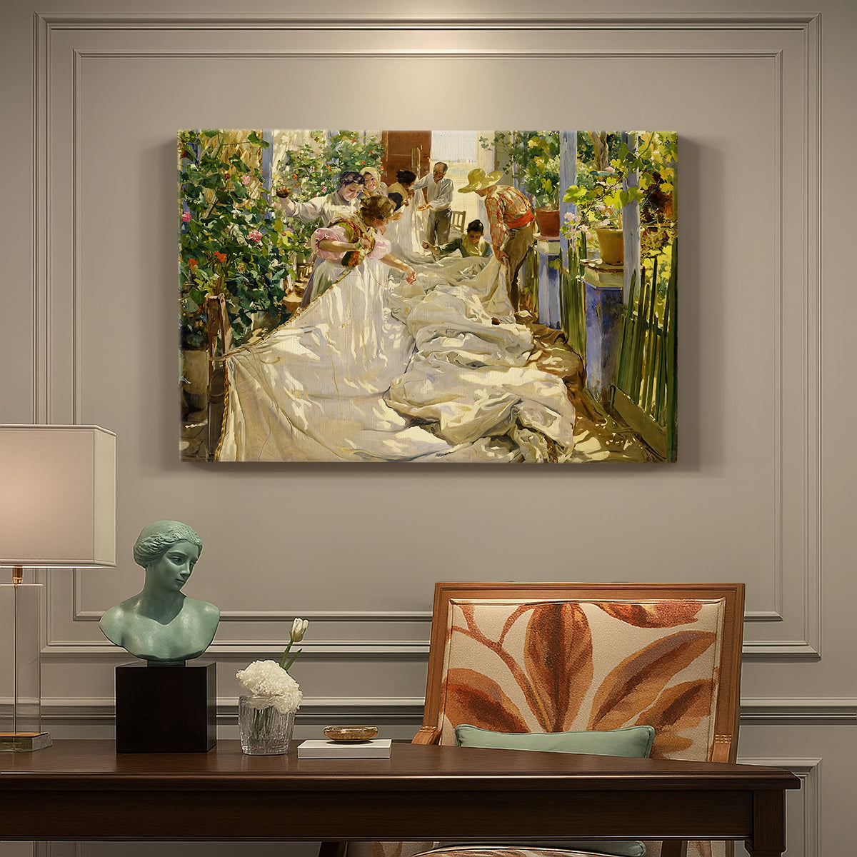 Canvas art print featuring figures working together sewing large sail outdoors in bright light, presented within a refined interior setting