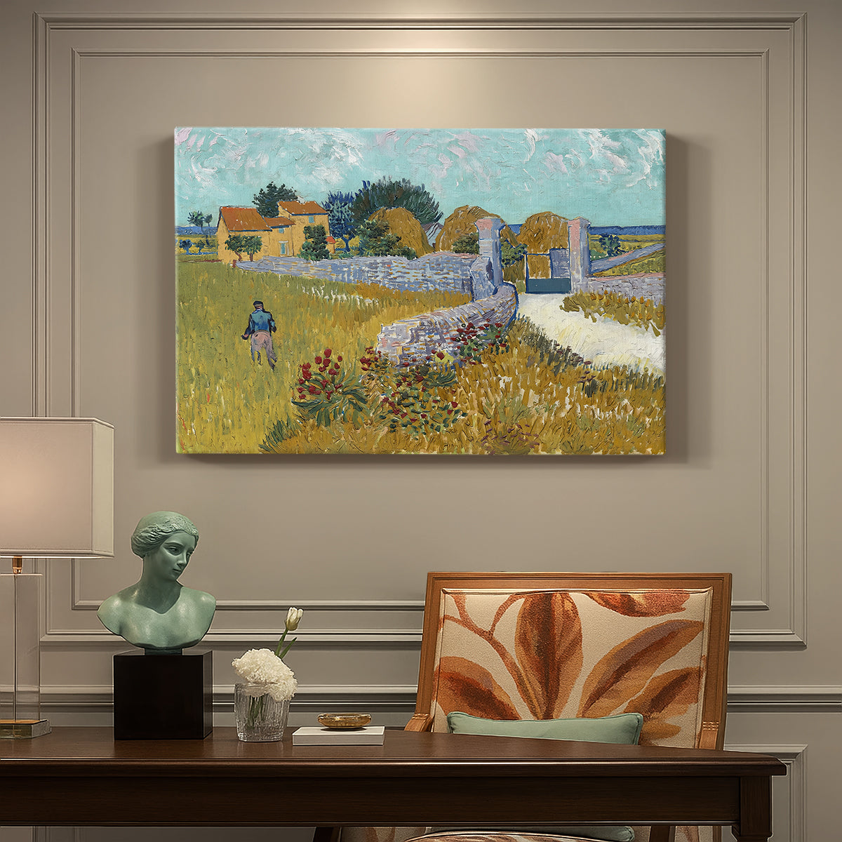 Canvas art print featuring a small farmhouse surrounded by yellow field and trees under blue sky, presented within a refined interior setting