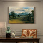 Canvas art print featuring a village landscape and countryside under wide sky, presented within a refined interior setting