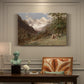 Canvas art print featuring a mountainous landscape with rugged terrain and distant peaks, presented within a refined interior setting