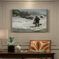 Canvas art print featuring figures walking along snowy path in winter landscape with wind and cold atmosphere, presented within a refined interior setting
