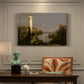 Canvas art print featuring a ruined city overgrown with vegetation under quiet, empty sky, presented within a refined interior setting