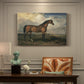 Canvas art print featuring a horse standing prominently in open landscape with strong posture, presented within a refined interior setting