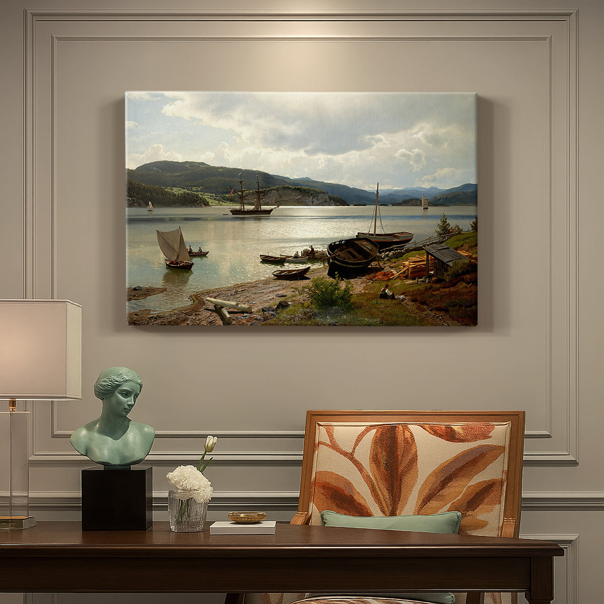 Canvas art print featuring figures and boats gathered along shoreline in calm coastal setting, presented within a refined interior setting