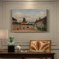 Canvas art print featuring a quiet suburban landscape with buildings, road, and open terrain, presented within a refined interior setting
