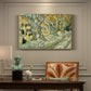 Canvas art print featuring a road lined with large trees where workers are gathered along path, presented within a refined interior setting