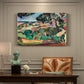 Canvas art print featuring a vivid landscape with hills, trees, and buildings near the coast, presented within a refined interior setting