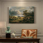 Canvas art print featuring a couple seated resting in open field, presented within a refined interior setting