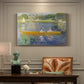 Canvas art print featuring two figures seated in a small boat drifting across calm water, presented within a refined interior setting