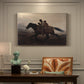 Canvas art print featuring a family riding horseback through night escaping across landscape, presented within a refined interior setting