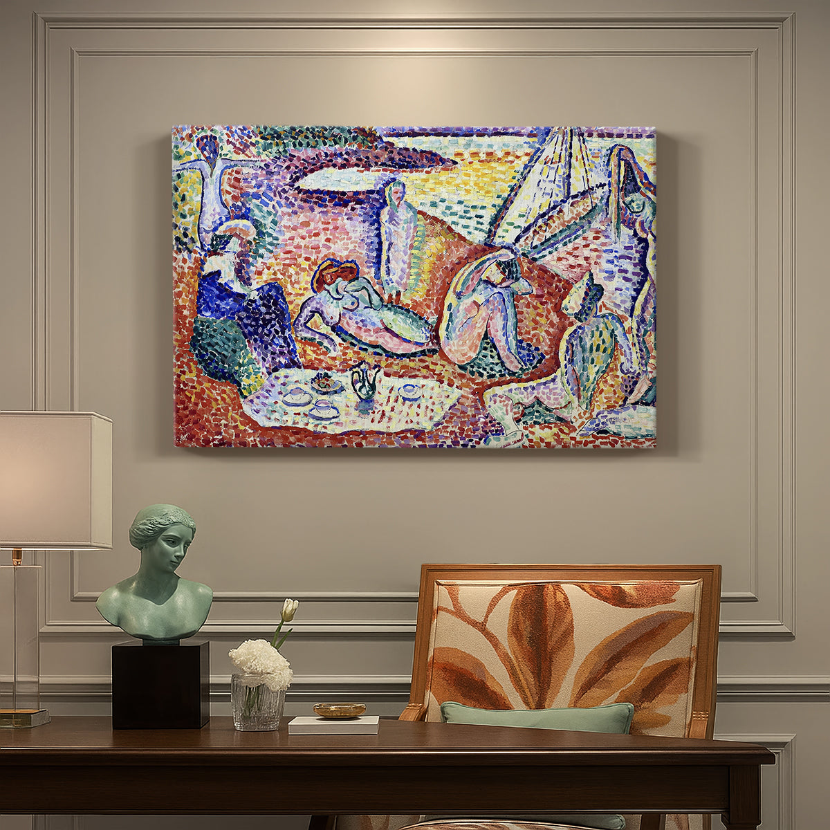 Canvas art print featuring figures lounging outdoors in a vibrant coastal setting with water views, presented within a refined interior setting