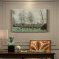 Canvas art print featuring women washing clothes beside water under willow trees, presented within a refined interior setting
