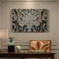 Canvas art print featuring a dense repeating pattern with animals, plants, and decorative elements across fabric, presented within a refined interior setting