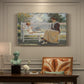 Canvas art print featuring a woman and child seated outdoors in natural light, presented within a refined interior setting