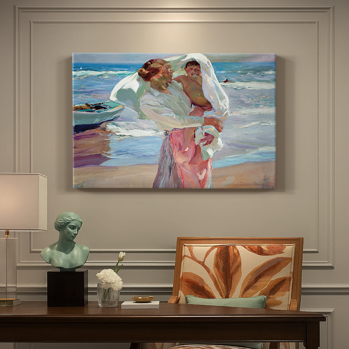 Canvas art print featuring figures standing on beach drying off after swimming in sunlight, presented within a refined interior setting