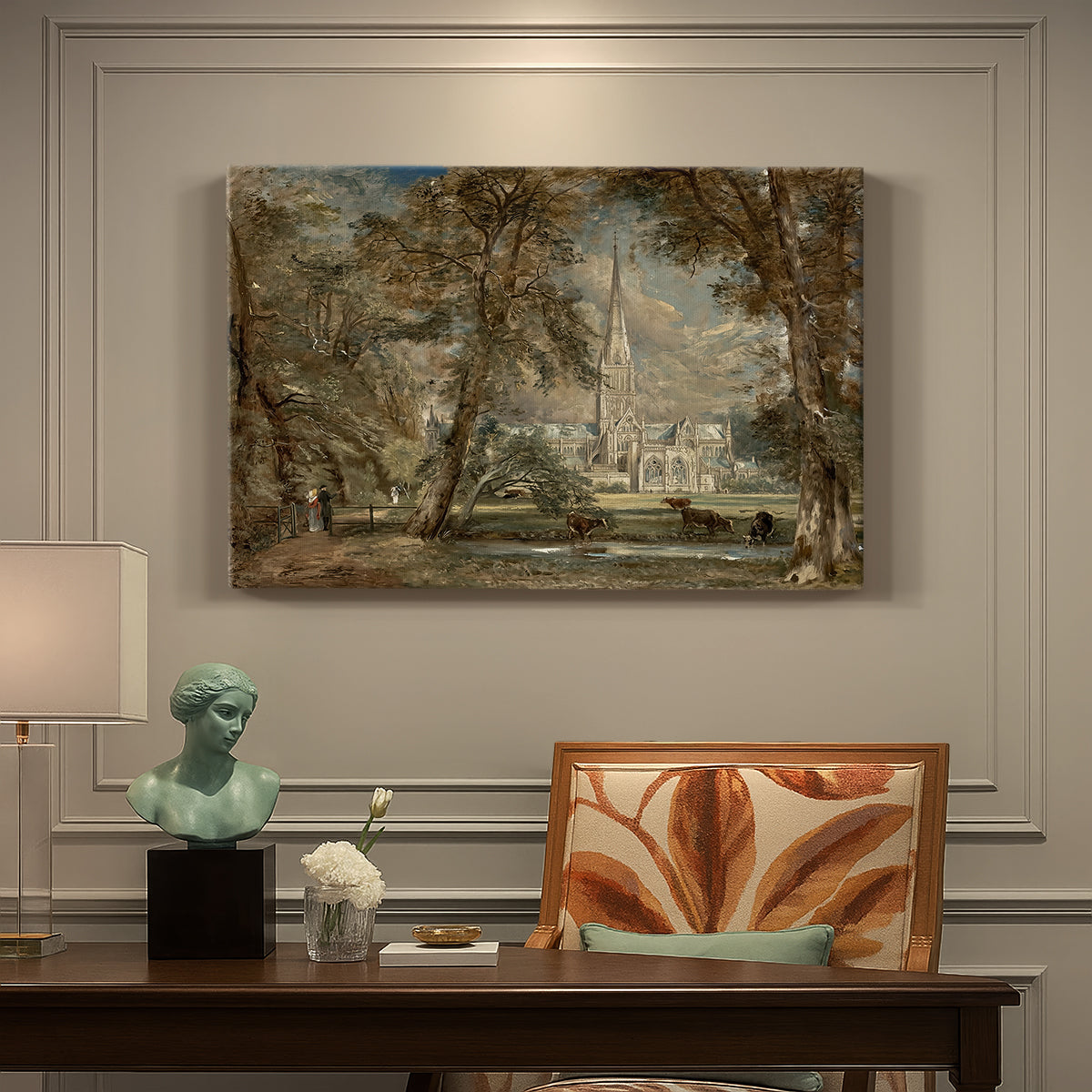 Canvas art print featuring a cathedral rising above landscape with trees and field, presented within a refined interior setting