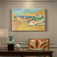 Canvas art print featuring a bright coastal townscape with buildings, water, and vivid colors, presented within a refined interior setting