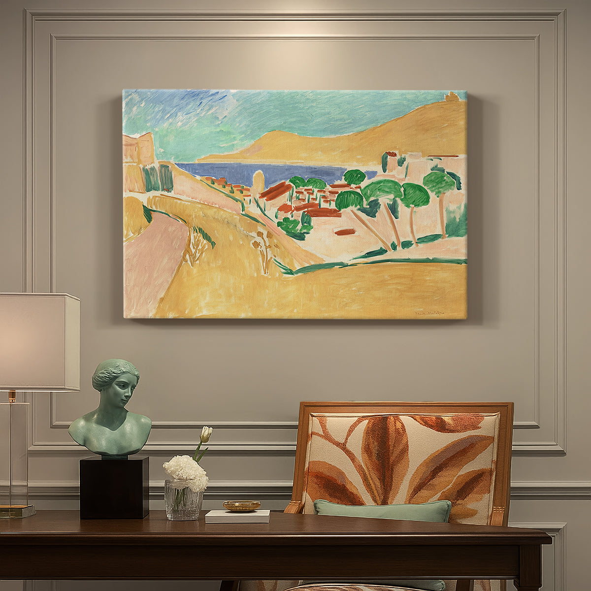 Canvas art print featuring a bright coastal townscape with buildings, water, and vivid colors, presented within a refined interior setting