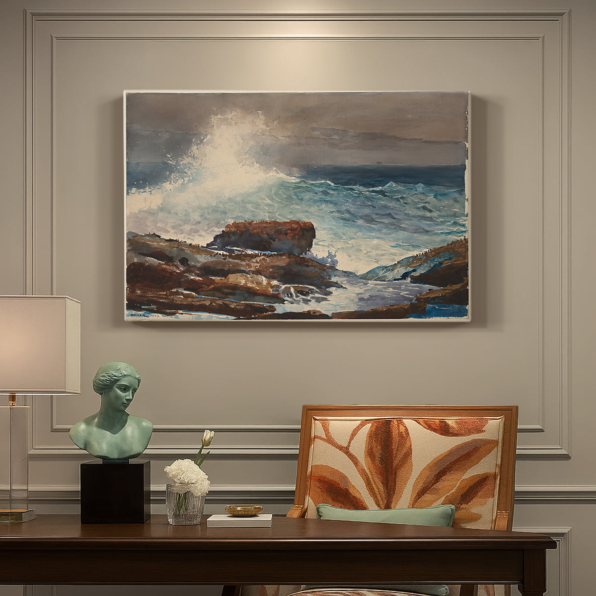 Canvas art print featuring waves rolling toward rocky shoreline with low buildings nearby, presented within a refined interior setting