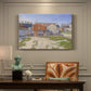 Canvas art print featuring industrial gas structures in urban landscape, presented within a refined interior setting