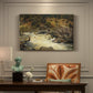 Canvas art print featuring a waterfall cascading down rocky slope surrounded by forest, presented within a refined interior setting