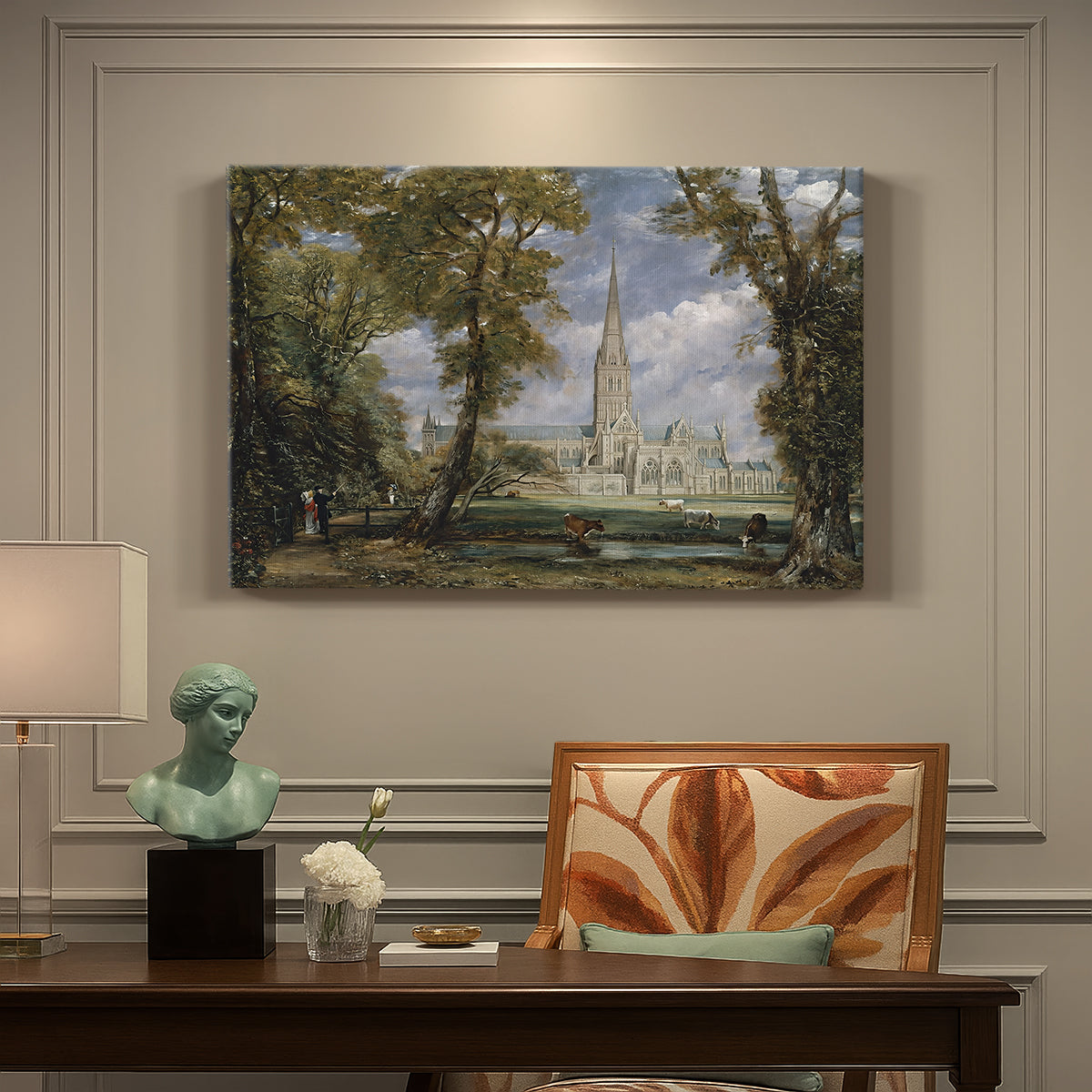 Canvas art print featuring a cathedral rising above landscape with trees, presented within a refined interior setting